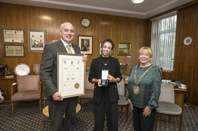(centre) Double Olympian Chelsie Giles visited the Mayor's Parlour to receive the Freedom of the Borough from (left) Dan Green, Rugby Borough Council's acting chief executive, and the Mayor of Rugby, Cllr Barbara Brown.