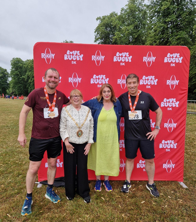 (left) John Slinger, MP for Rugby, and (right) Cllr Michael Moran, leader of Rugby Borough Council, celebrated completing the Couch to 5K with (second left) the Mayor of Rugby, Cllr Barbara Brown, and (second right) Cllr Maggie O'Rourke, Rugby Borough Council portfolio holder for partnerships and wellbeing.