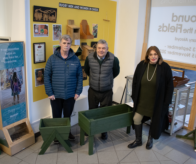 (left to right) Keith, from the Rugby Men and Women in Sheds project, joined Cllr Neil Sandison and Cllr Maggie O'Rourke to view the display in Rugby Art Gallery and Museum's community space in the venue's foyer.
